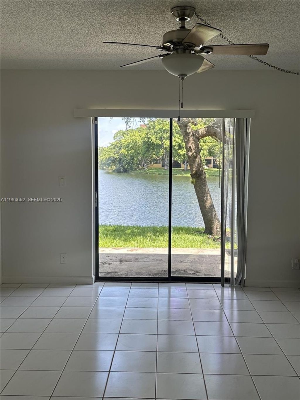 Photo of 10003 Winding Lake Rd #103, Sunrise, FL 33351 (MLS # A11994662)