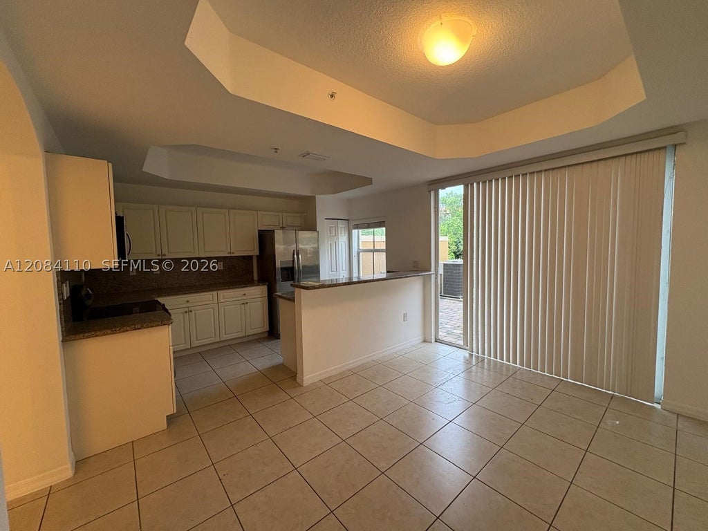Photo of 1037 SW 143rd Ave #1305, Pembroke Pines, FL 33027 (MLS # A12084110)
