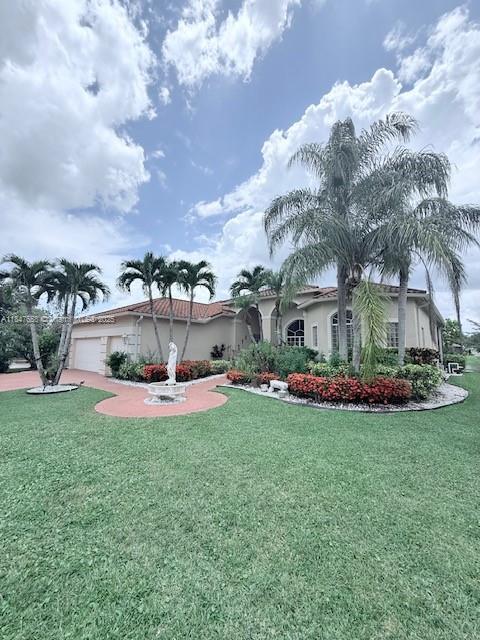 Immaculate home nestled in the highly sought after community waterways of Naples! Beautifully kept home boasts 4 bedrooms, 3 bathrooms, and a den. Spacious kitchen with a chef's dream! Spectacular living room and dining room area great for hosting events or special occasions. Screened pool, lake view and exuberant landscaping offering a private a serene retreat. 2019 ROOF. Gated community with security. Superb community offering tennis, basketball courts, volleyball, fitness gym, community pool, and club house. Exotic fruit trees such as mango and soursop! Perfectly placed in a vibrant and growing community. Tiki hut and BBQ with friends and family with a luminous lake view as you unwind to the sunset. Fine dining nearby. This is an invitation to make this warm comforting residence yours!