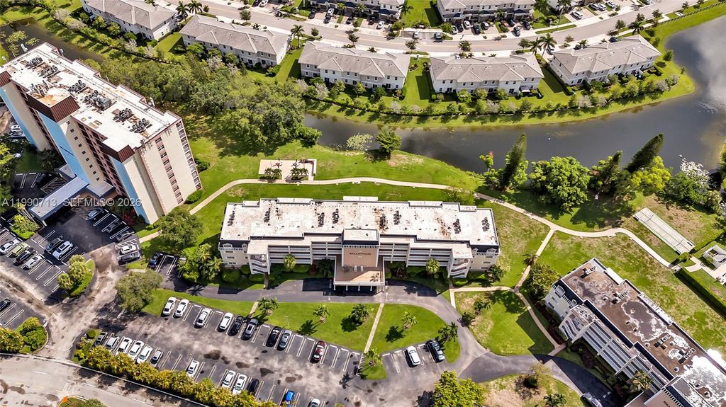 Photo of 3535 Broken Woods Dr #302, Coral Springs, FL 33065 (MLS # A11990713)