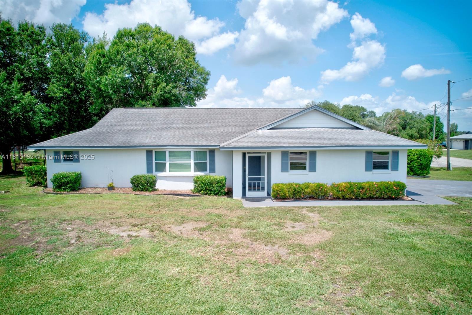 Don’t miss this spacious waterfront home on a canal with direct access to Lake Grassy, a 529-acre ridge lake. Featuring 3 bedrooms, 2 bathrooms, and 1,920 sq ft, recent updates include a new roof (2018), modern kitchen with granite island, and luxury vinyl plank flooring. Enjoy unobstructed lake access, perfect for fishing, boating, or water sports. The property includes a two-car garage and waterfront frontage at an affordable price. Community amenities, for an additional $30/year, include a boat ramp, tennis and pickleball courts, a clubhouse, picnic areas, and more. Move-in ready—start your lake life today!