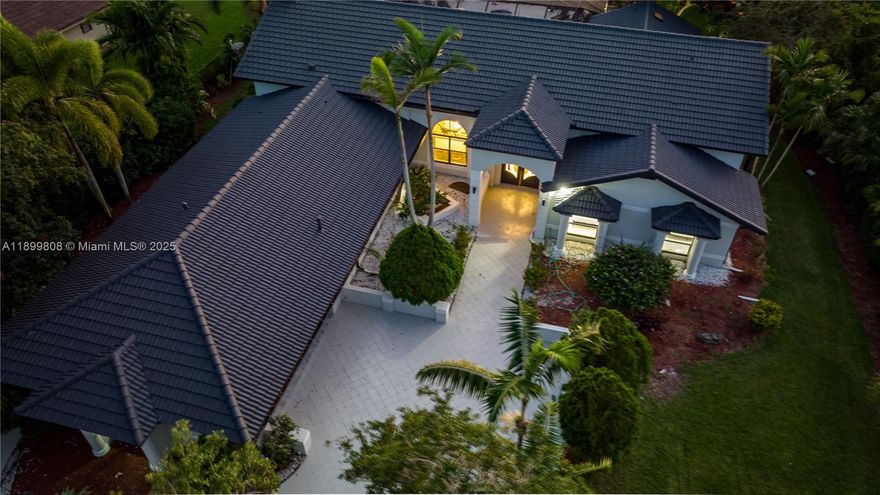 Experience luxury living in this stunning 7-bedroom, 5-bath estate located in the heart of Plantation. Perfect for both everyday comfort and entertaining, this expansive home features a state-of-the-art game room, spacious living areas, and a private pool surrounded by lush landscaping. The gourmet kitchen is equipped with high-end appliances and elegant finishes, ideal for those who love to cook and gather. Just minutes from Fort Lauderdale’s beautiful beaches, fine dining, and shopping, this exceptional property offers the perfect balance of tranquility, convenience, and timeless sophistication.