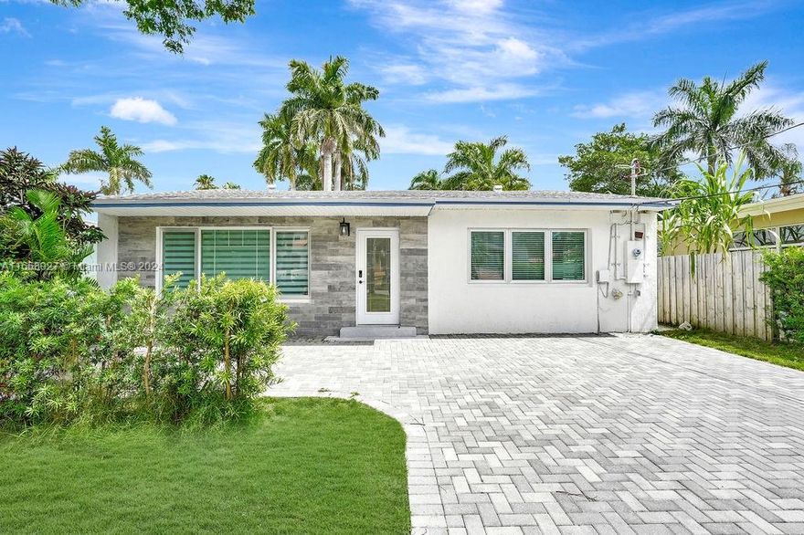 Hollywood Lakes Retreat: Step into this fully renovated 3-bedroom, 2-bathroom haven, filled with natural light and elegant finishes. The open floor plan is perfect for entertaining, while impact windows and doors provide peace of mind. A versatile en suite bedroom offers a serene primary suite or rental opportunity.  Enjoy the vibrant neighborhood, just steps from waterfront dining, pristine beaches, and convenient amenities.  This home offers effortless elegance, comfort, and the ultimate South Florida lifestyle. All permits closed, ready for you to move in!