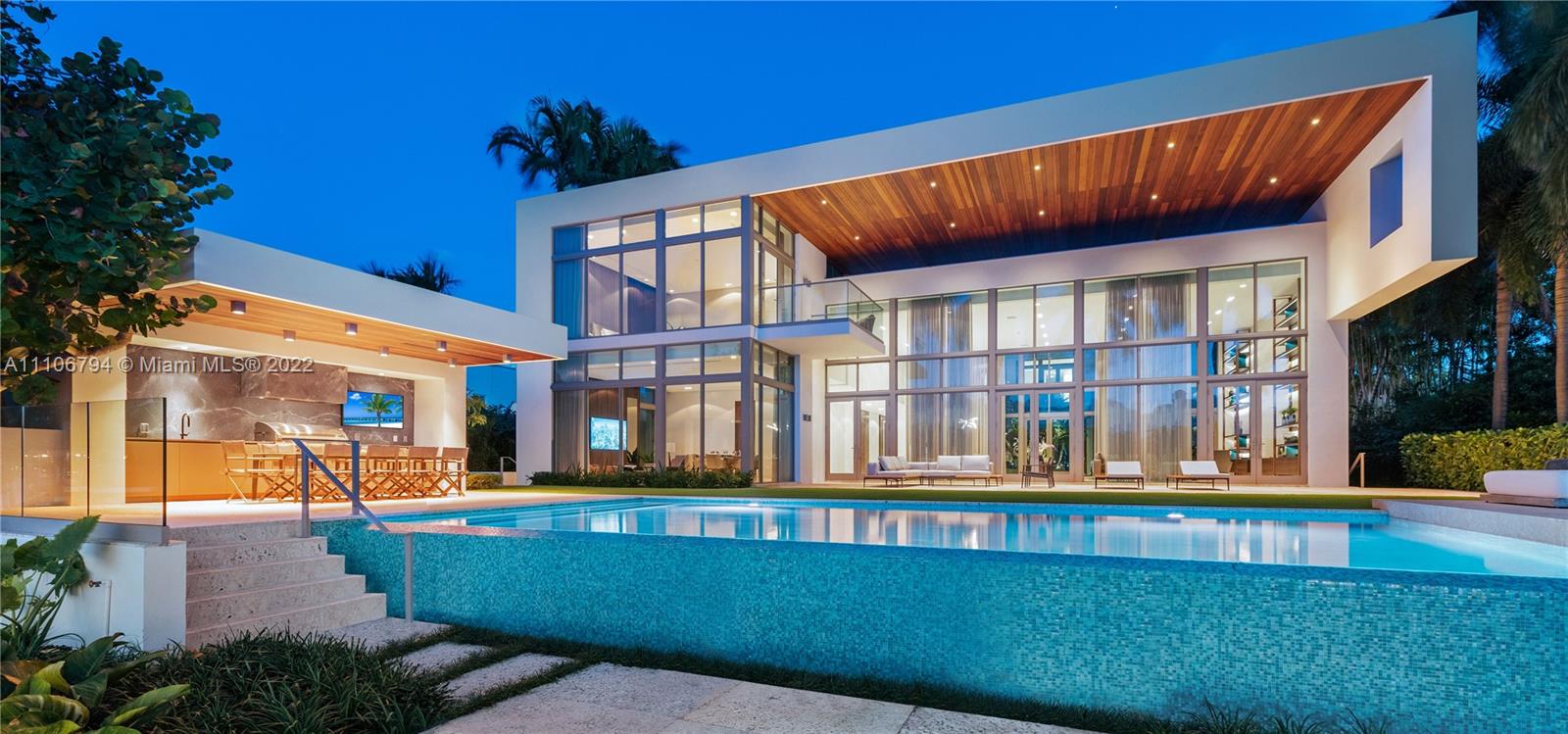 Stunning sunsets, prestigious North Bay Rd modern waterfront home by the AquaBlue Group. Unique architectural concept by Touzet Studio, featuring a massive, one-of-a-kind, double-height great room. Immersed in glass, living areas offer captivating views of garden & Bay. The residence is comprised of 7 Bdrms, 8 bths. Custom Italian expansive kitchen and chef’s kitchen. Bespoke crafted, luxurious, Italian millwork throughout the home. Grand master suite w direct bay views & morning kitchen. Lavish master bathroom & closets. Detached outdoor kitchen and cabana bathroom. Separate guest quarter w garden & water views. Lush landscaping w mature trees, welcoming green wall, & gardens. Fully automated smart home. Commercial-grade elevator. Curated w custom, branded Italian furniture included.