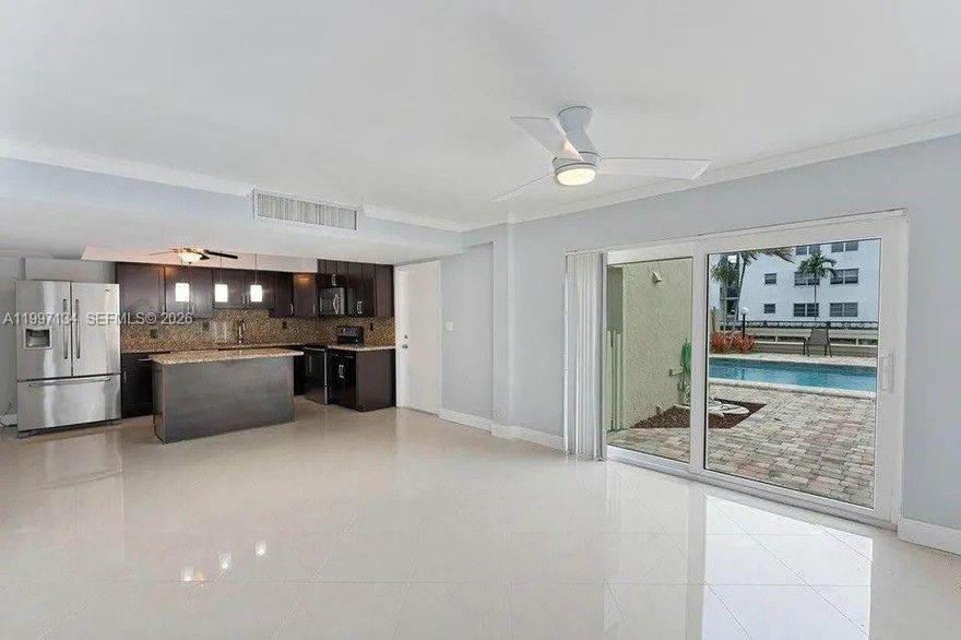 Rarely available 3-bedroom, 3-bath corner unit in Coral Ridge Isles with direct pool access and water views from every bedroom. This spacious 1,752 sq ft condo features a split floor plan, large living and dining areas, updated kitchen with stainless steel appliances and granite countertops, remodeled bathrooms, and in-unit washer/dryer. Includes 2 assigned parking spaces. Conveniently located near shops, restaurants, and just minutes from the beach. 600+ CREDIT SCORE REQUIRED BY ASSOCIATION