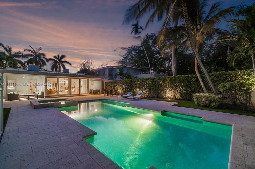 Fabulously carefree with iconic South Beach moods, this Bayshore daydream blends mid-century modern simplicity with nostalgic sea-spray hues, bespoke finishes, and curated sightlines of your Art Deco pool. Built in 1939 and reimagined in 2007, 1,622 sq ft of bungalow charm feels voluminous with three airy bedrooms, two refreshing baths, and a sunroom-serving custom kitchen. Prep meals using professional-grade appliances, pour wines for friends at the island, gather near the hearth-warmed living room, and slide away floor-to-ceiling glass to welcome breezes. While manicured tropical greens frame patio conversation and evening swims, from your air-conditioned garage prep for adventure where miles of pristine shoreline, Miami Beach Golf Club, favorite spas, and vibrant nightlight await.