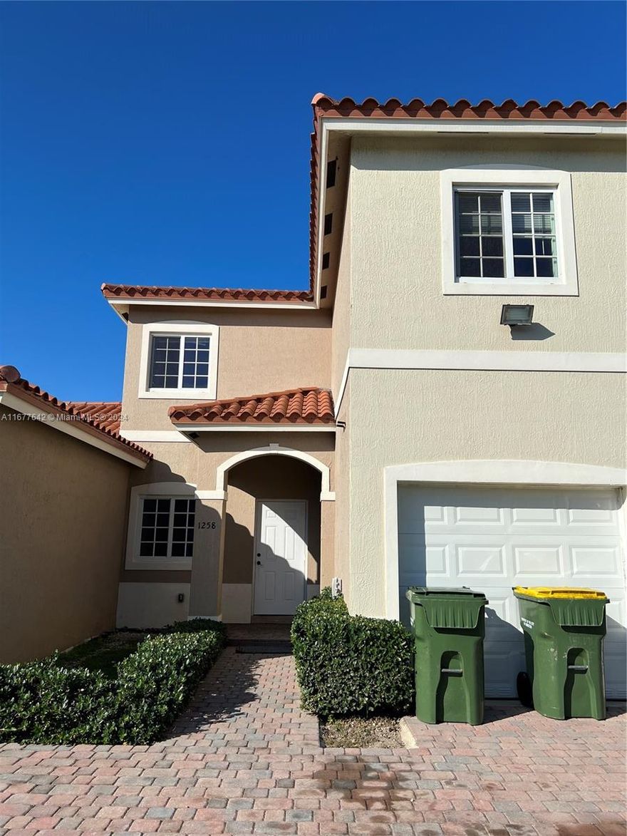 Welcome to this stunning 3-bedroom, 2.5-bathroom townhome located in the heart of Homestead, FL. This spacious and beautifully maintained property features tile and wood flooring, giving it a sleek feel. The open floor plan is perfect for both everyday living and entertaining, with a gourmet kitchen with stainless steel appliances and ample cabinet space. Upstairs, you’ll find three generously sized bedrooms, including a master suite with its own private bath. The other two bedrooms share a well-appointed full bathroom. A convenient half bath is located downstairs for guests. Other highlights of this lovely townhome include an attached garage & enclosed patio. Easy access to nearby shops, dining, schools, and parks. Don’t miss your chance to make this beautiful property your home!