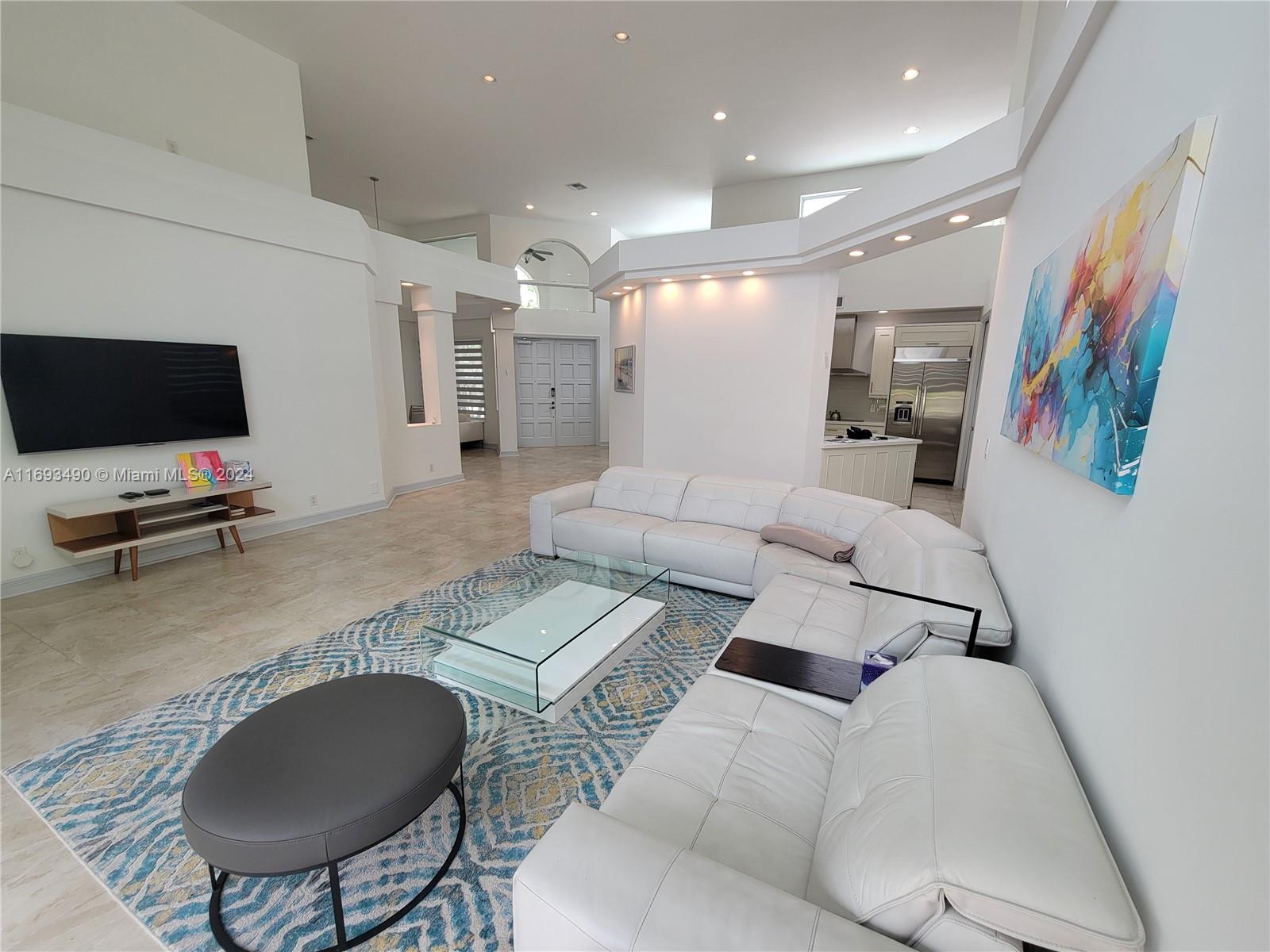 Exclusive beautiful modern 3 bedroom 2.5 bathroom home in Boca Grove's Island in the Grove, features soaring ceilings, & abundant natural light. Fenced backyard, enclosed w/ lush greenery, and water with fountain views. Home boasts semi-open kitchen all modern appliances. Recent upgrades new AC and roofing. Boca Grove offers luxury amenities including, a premier golf course, resort-style swimming pool, on-site bar and restaurant, child care, complimentary daily breakfast, & more. Conveniently located near places of worship, shopping, & nightlife.