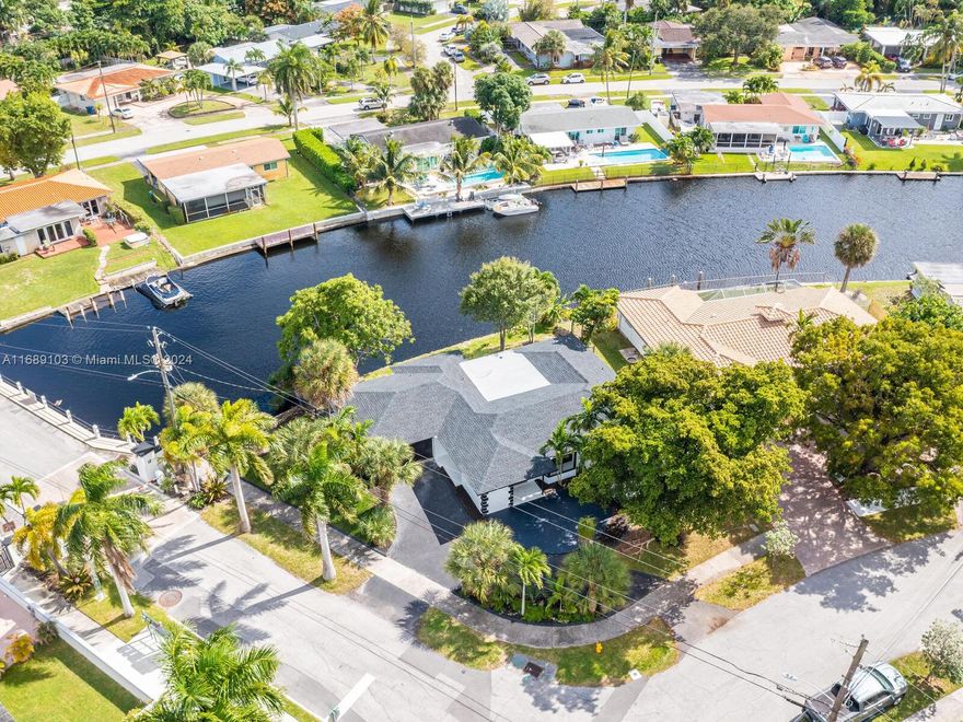 Secluded island oasis near Ft. Lauderdale w/ocean access, offering water view from most rooms. This gorgeous property has been completely renovated from roof to sewer. Brand new Kitchen w/quartz counters/waterfall, wine station, s/s appliances & soft close feature. Also brand new are the high impact windows & doors, roof, electrical service, sewer, wiring, plumbing fixtures, floors, drywall, A/C, bathrooms, closets & more. The cabinets are all custom made & solid wood. All materials used are of high quality; no expenses spared. The house can be purchased furnished. No HOA. Low insurance premium & taxes. All laminate flooring has been replaced with gorgeous neutral porcelain tile. Easy to​​‌​​​​‌​‌​​​‌‌​​​‌‌‌​​‌​​‌‌​​​​ show.