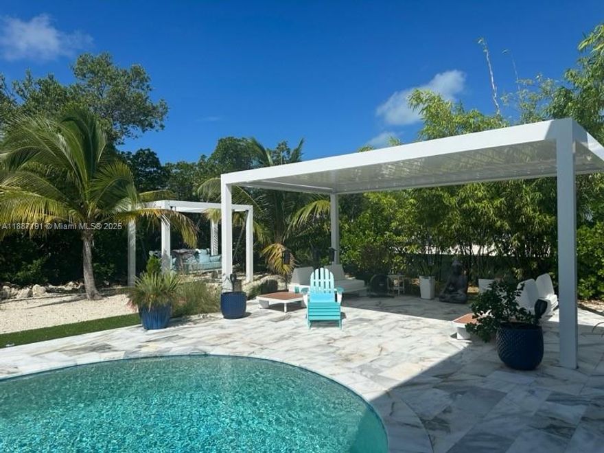 Live the island lifestyle in this beautiful 4-bedroom, 2-bath pool home near Coco Plum Beach. Just minutes from the ocean, this rental offers a bright, open layout with spacious living areas perfect for relaxing or entertaining. Enjoy your own private pool surrounded by lush tropical landscaping. The home is conveniently located close to beaches, boating, dining, and shopping, making it ideal for those seeking comfort and coastal charm. Water and electricity are included in the rent, providing worry-free living. Experience the best of the Florida Keys in this move-in ready home, perfectly situated near the ocean and the heart of Marathon.