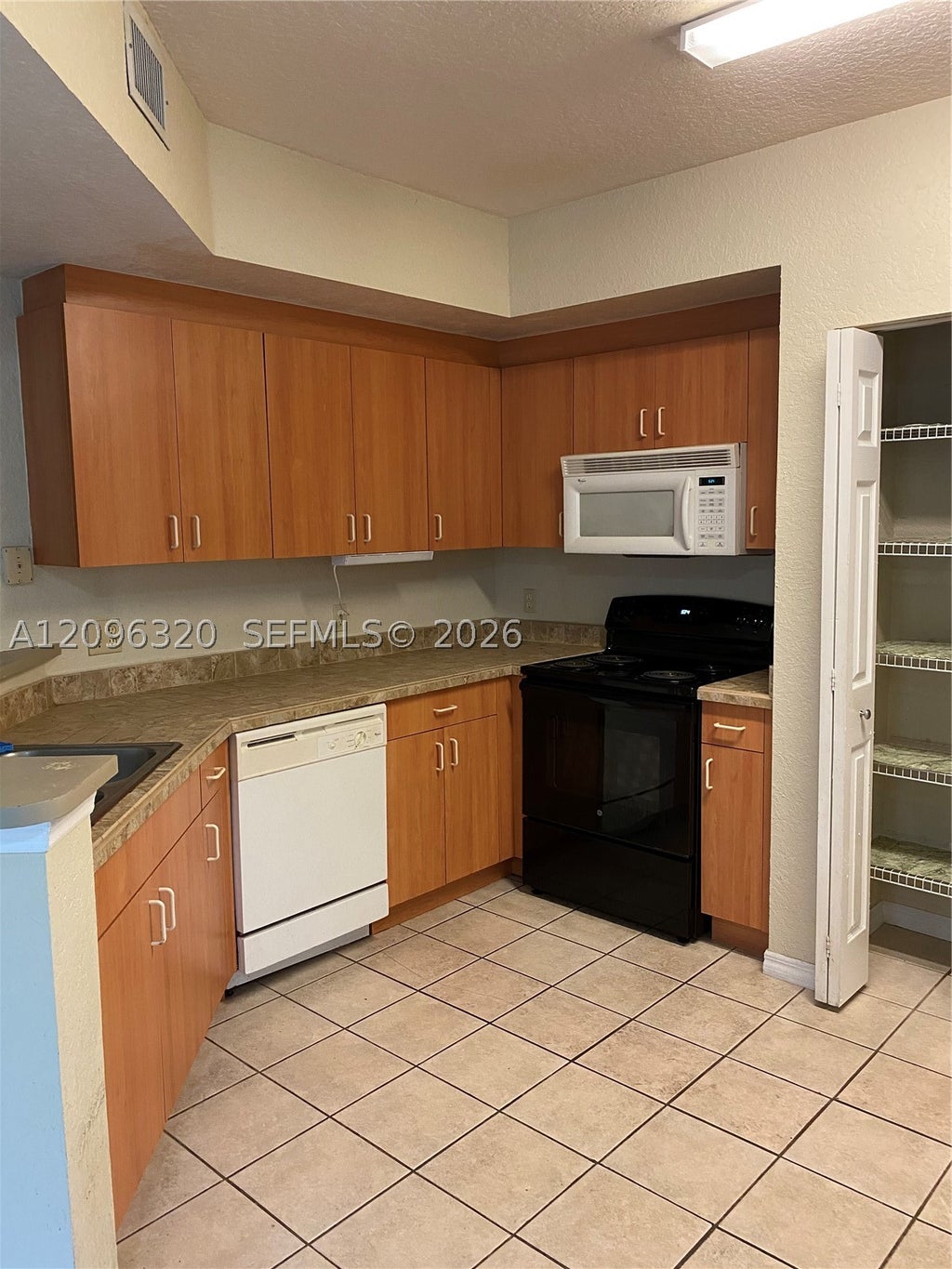 Photo of 307 Belmont Ln, North Lauderdale, FL 33068 (MLS # A12096320)