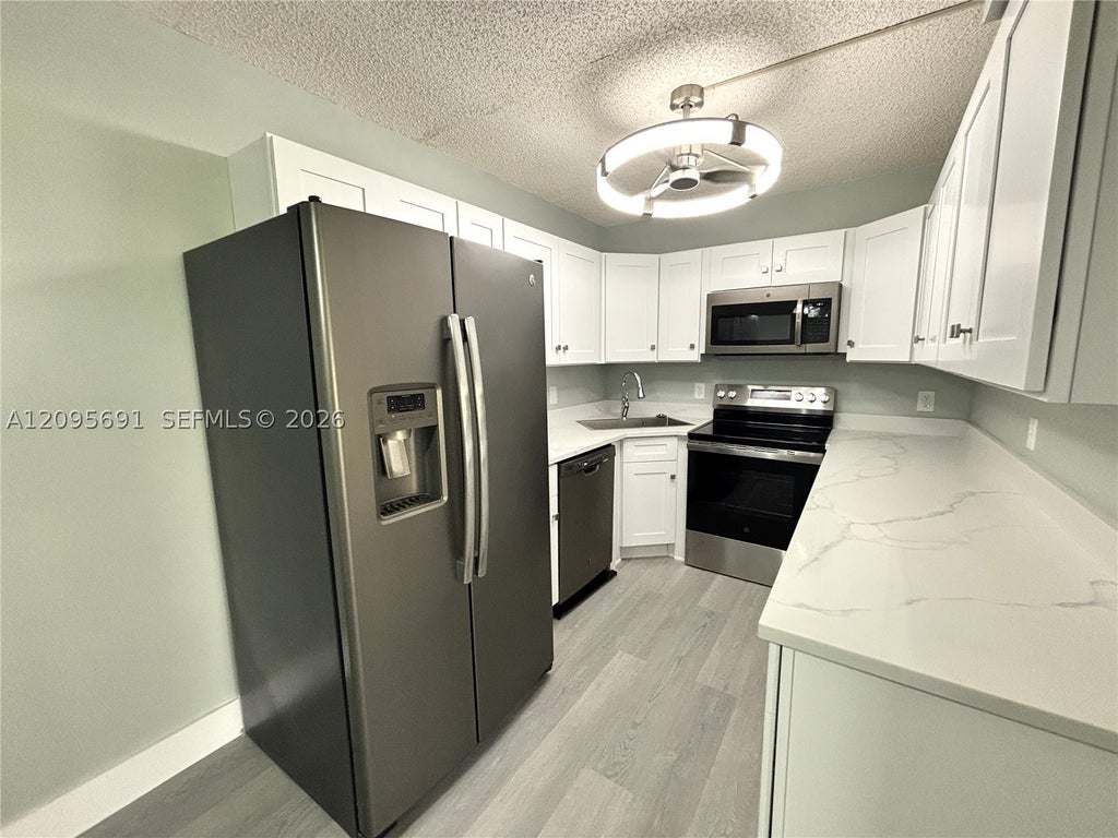 Photo of 2733 SW Matheson Ave #115-E1, Palm City, FL 34990 (MLS # A12095691)