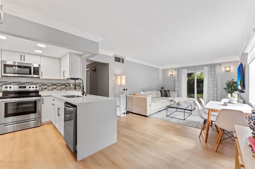 NEW YEAR, NEW HOME! Take advantage of a Seller contribution of up to $5,000.00 toward Buyer closing costs! Nested in the heart of Pinecrest, this beautifully updated 2BR/1BA corner unit offers boutique-style living! This bright first-floor home features impact windows & sliding doors that fill the space with natural light. Inside, enjoy vinyl floors throughout and a modern kitchen with quartz countertops & recently updated appliances. The large master bedroom includes a walk-in closet, and the bathroom is fully renovated with sleek finishes. In-unit washer/dryer adds convenience. Relax at the community pool or enjoy your private outdoor area. Gated community with 2 assigned parking spaces, plus convenient access to guest parking right in front of the property. Prime location—just a walk to the Metrorail with direct transportation to Downtown Miami and minutes from Dadeland Mall, shops, and dining! CAN PURCHASE WITH FINANCE, THE HOA HAS RESERVES!