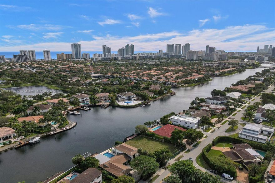 Don’t miss out on this striking waterfront land, perfect for avid boaters, tennis players, and golfers! This nearly 12,000 Sq. ft. lot features ocean access with 95 ft. of deep water frontage on Diplomat Parkway, offering breathtaking views of Harbor Island. Located on a quiet street within walking distance to the new Shell Bay, part of the Auberge Resort Collection, it provides access to a Greg Norman championship golf course, private yacht club, wellness spa, and exclusive amenities. The ultra-private golf course requires a $1.3 million membership fee. The asking price includes both the land and architectural plans designed by Hugo Mijares-OneDBMiami. Inquire today to uncover this rare opportunity to build your dream waterfront estate!