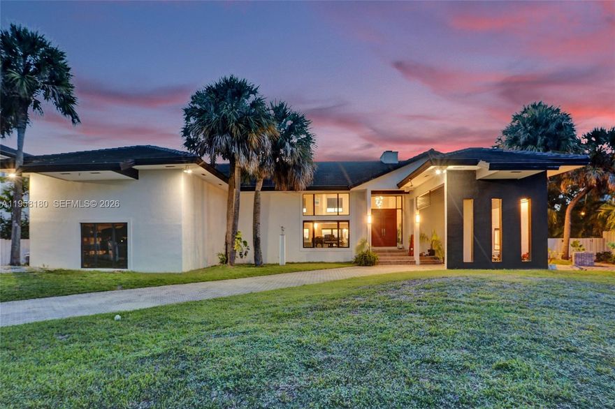 Waterfront residence on E-Lake, one of Miami’s recreational lakes permitting active water use, including jet skiing, water skiing, sailing, and kayaking (subject to local regulations).

The home offers expansive living areas with marble flooring on the main level and bamboo hardwood upstairs. The kitchen is appointed with Miele, Sub-Zero, and Wolf appliances, quartz countertops, and custom cabinetry.

Outdoor features include direct lake access, private beach area, covered lanai, and jacuzzi, providing year-round indoor-outdoor living.
