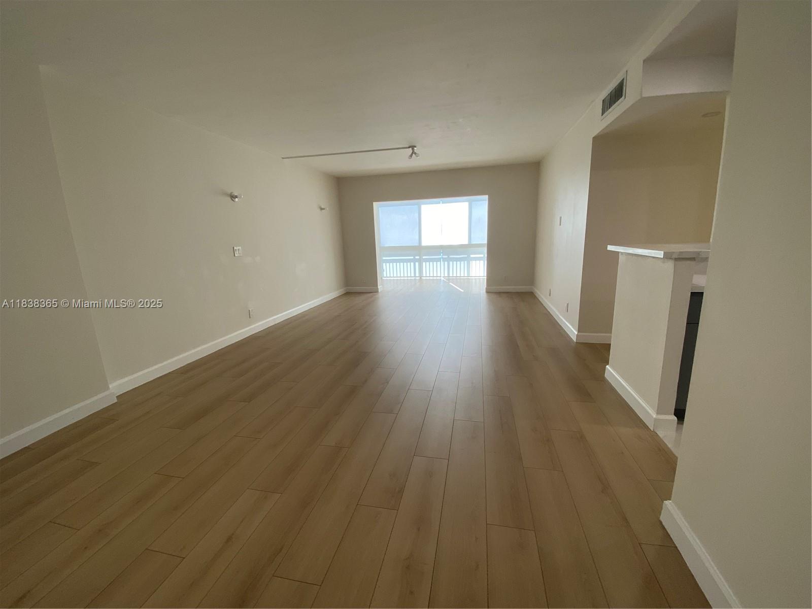 One of the finest apartments in the complex, fully remodeled with modern finishes throughout. This unit features a brand new kitchen, equipped with stainless steal appliances, quarts countertops and an additional bar area in living room. Beautifully designed new bathrooms, new laminate flooring, impact windows, baseboards, recessed lights, stylish shades, and more add to its appeal.
The enclosed balcony provides a versatile space, perfect for a home office or relaxation area. The apartment includes extra storage, one assigned parking space, and the option to lease an additional parking spot for a fee. Ideally located near major roads, shopping centers, and everyday conveniences.