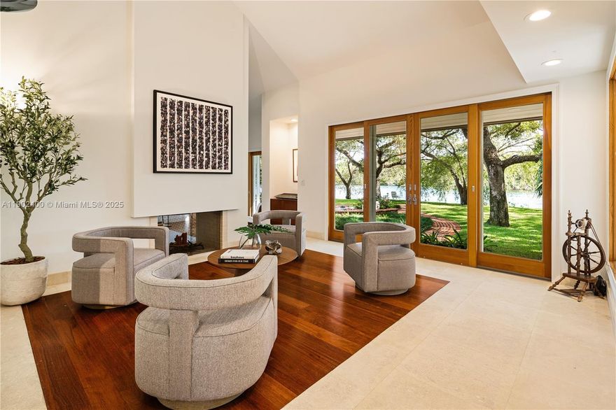Welcome to an enchanting residence nestled in the prestigious gated enclave of Banyan Drive in Coral Gables. This spectacular lakefront property spans over an acre graced w/majestic oaks. The elevated contemporary architecture w/its new kitchen & baths, warm wood floors, & numerous entertaining spaces, all harmonize w/nature providing a stunning backdrop for daily life. Each room is designed to capture natural light & offer breathtaking views of the water & lush surroundings. Abundant space with the perfect angle for capturing the prevailing winds makes it an ideal setting for both intimate & grand gatherings alike. Experience nature w/early morning swims & sunset Kayak rides. This residence embodies a lifetime of elegance & comfort in a truly unparalleled location. A Very Special Home.