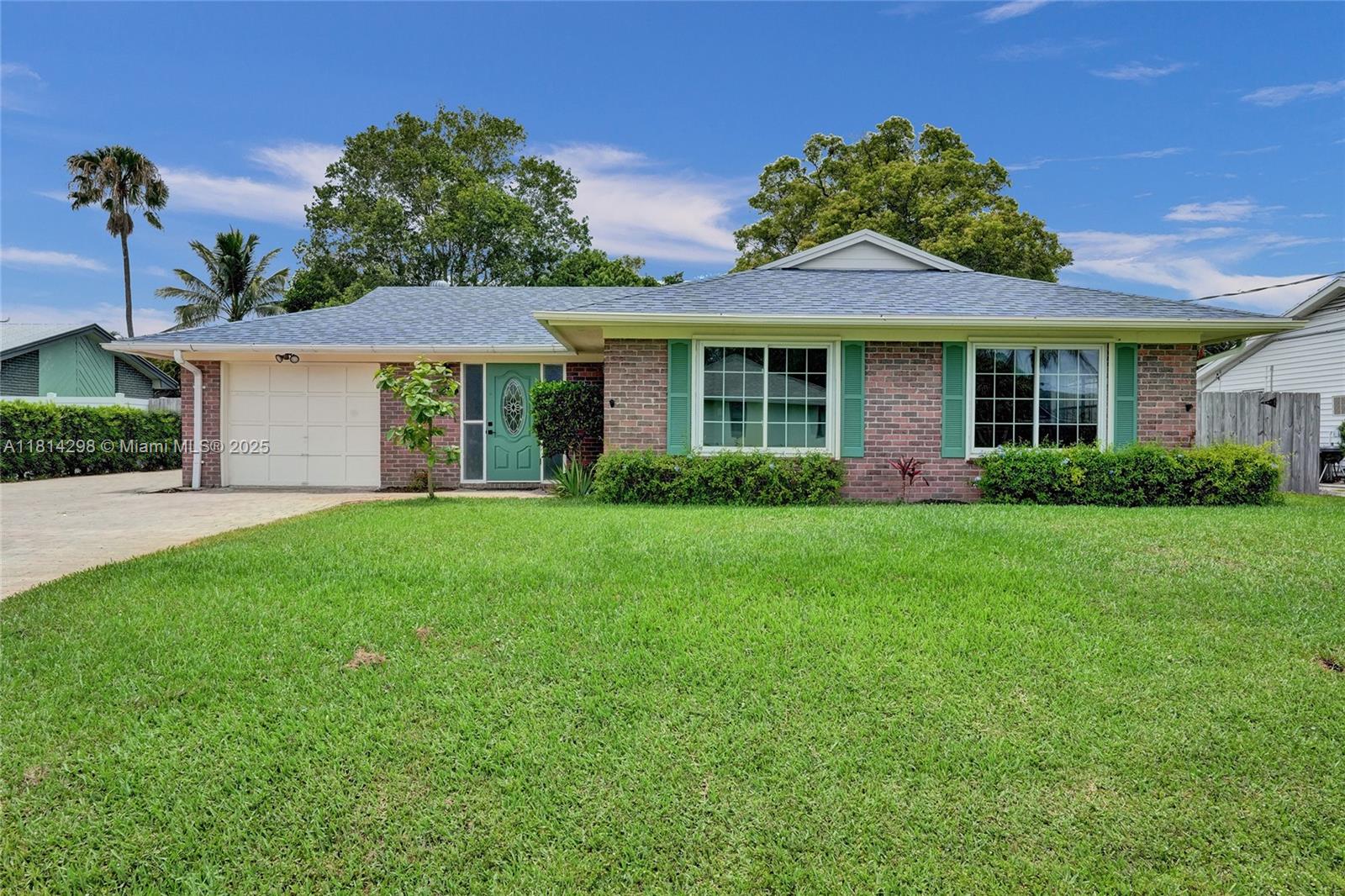 Welcome to this charming 3-bedroom, 2-bath pool home offering the perfect blend of comfort and Florida lifestyle. Step inside to find elegant Italian ceramic floors, a spacious open layout, and a kitchen with eye-catching mint cabinetry, granite counters, and newer stainless steel appliances. The home features mirrored closets, ceiling fans in every bedroom, and two beautifully updated bathrooms. Outside, enjoy a screened-in saltwater pool, covered patio with dual ceiling fans, and a bar area—ideal for entertaining. The oversized fenced yard is a peaceful retreat with lush landscaping and mature trees. Roof is just 4 years old!