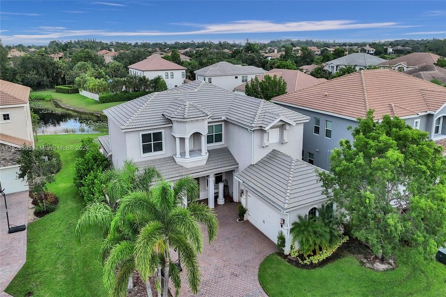 This stunning Wellington model boasts 5 BR, including one conveniently located on the first floor, 3.5 baths, office, loft and a spacious 3 car garage. Situated on a private lakefront cul-de-sac inside of a small community, this home features hurricane impact windows and doors, a heated saltwater pool installed in 2020, an outdoor area which includes a travertine tile deck, and a covered patio. The beautiful interior is highlighted by a gourmet chef's kitchen with granite countertops, GE Profile appliances, and a center island. The office has double French doors. Upstairs, the king-sized primary suite is entered from a large loft. This home is impeccable and welcoming.  (Lender credit up to $4500 which can be applied towards closing costs or rate buy down with preferred lender.)