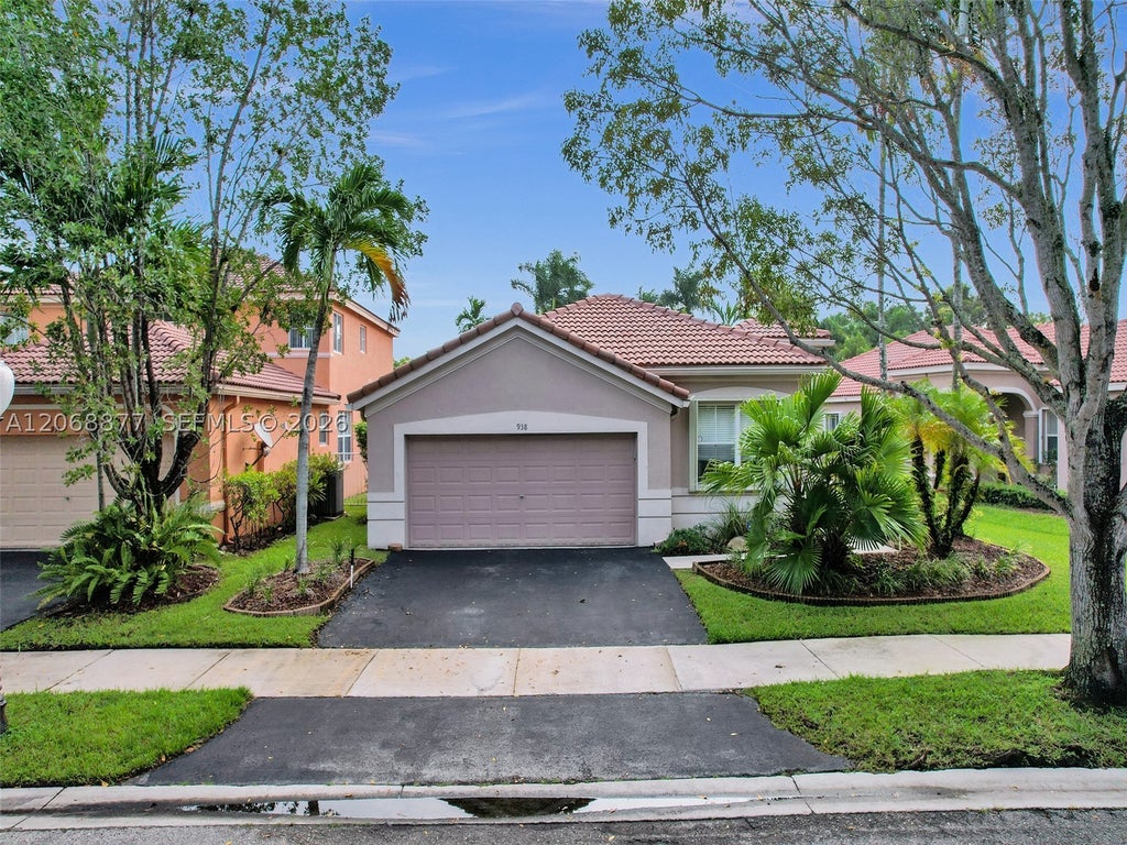 Photo of 938 Bluewood Ter, Weston, FL 33327 (MLS # A12068877)