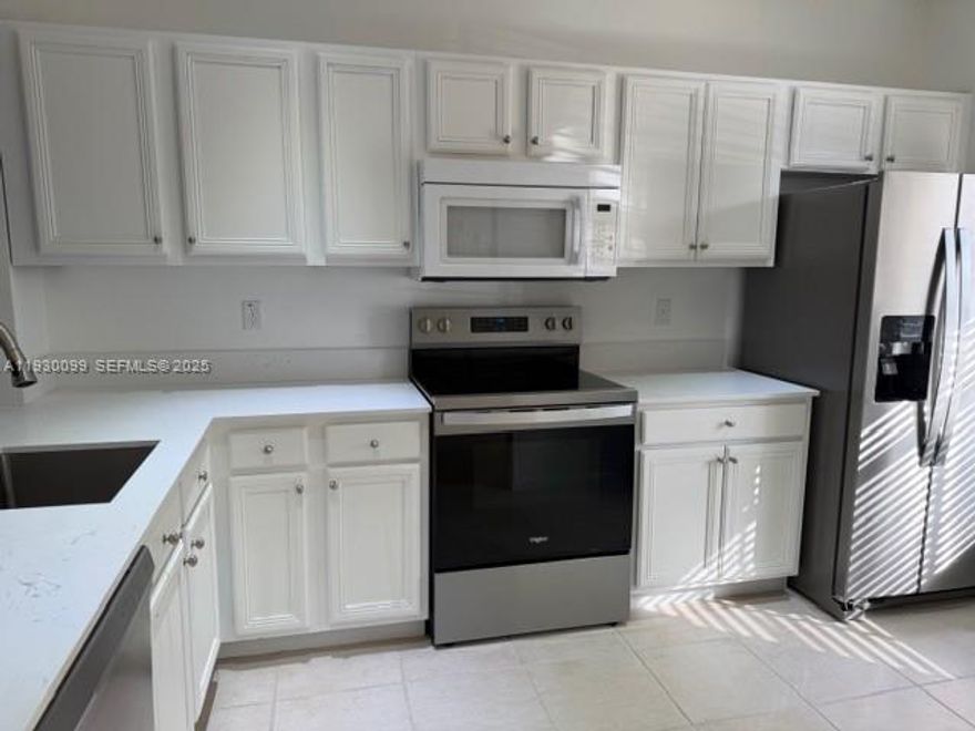 Corner 2 Bedroom 2 full bathrooms and 1/2 bathroom Townhouse. Freshly painted, renovated, tile floors downstairs and wood-like laminate floors upstairs.Quartz ckitchen counter tops, SS appliances. Washer and dryer inside unit. Walking closets. TWO parking spaces. Storage room on patio and lake view. Gated community offers fitness center, clubhouse, pool, children playground, and beach volleyball. Jonathan's Cove is very well located close of I-95 and turnpike. Walmart, shopping and more!