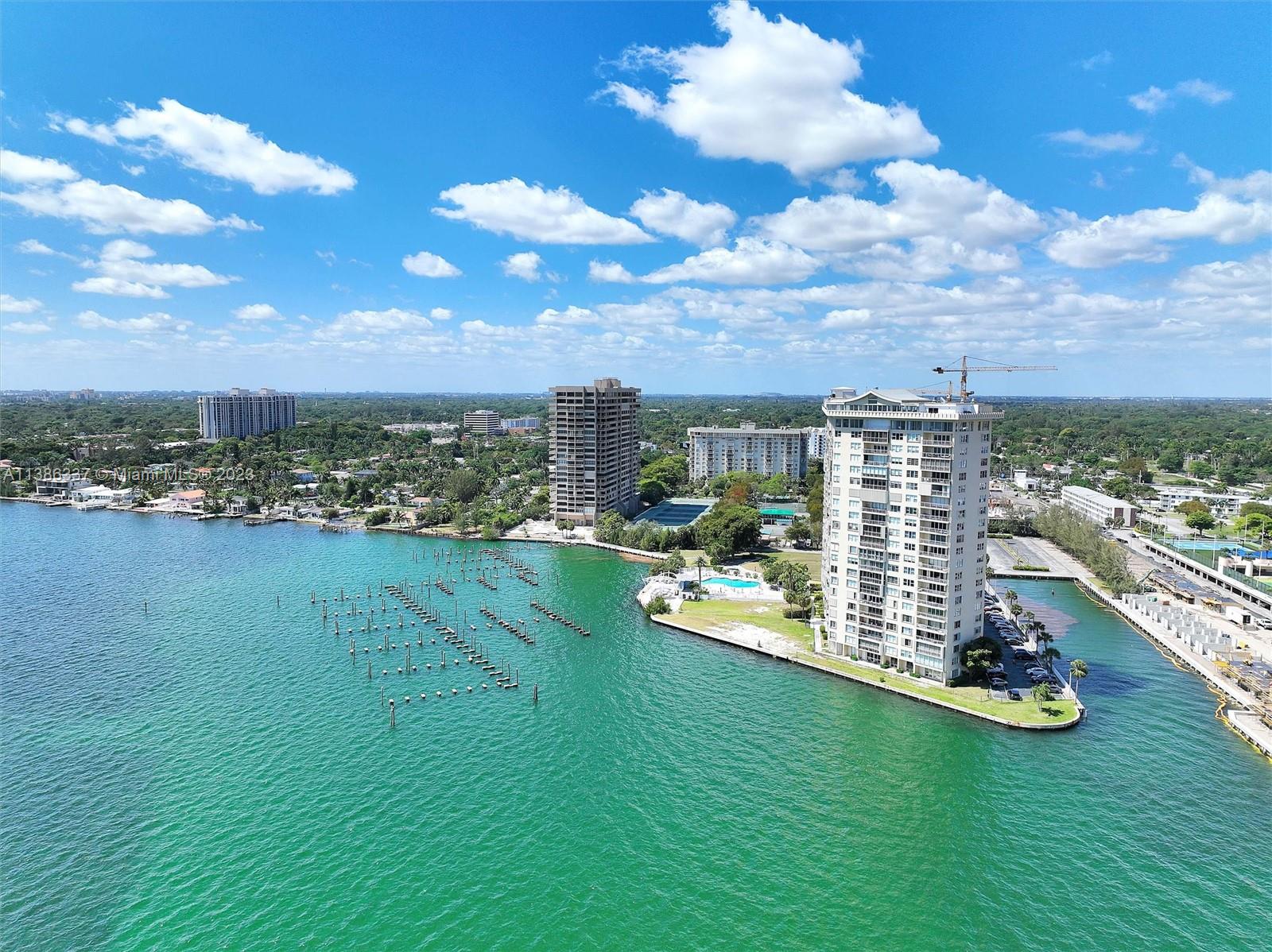 Remarkable unit on the 15th Floor with Breathtaking Views. Vast floor-to-ceiling breathtaking views! Condo boasts a large 1538 square ft split plan (including enclosed balcony), Sun-Filled Open Floor Plan with S /SE /SW unobstructed panoramic bay/Intracoastal water view. Minutes from the luxurious Bal Harbour Shops, beautiful beaches, golf & tennis at the Miami Shores Country Club, Wynwood and Miami Beach, Art Basel events, Whole Foods, and Starbucks within a few blocks. Maintenance includes hot water, cable TV/WI-FI, and complimentary valet. Less than 30 minutes to Miami or Hollywood /Ft. Lauderdale International Airports. 50-yr-Certified building with a renovated lobby. Easy renovation of the condo to your personalized taste. VIEW VIEW VIEW!