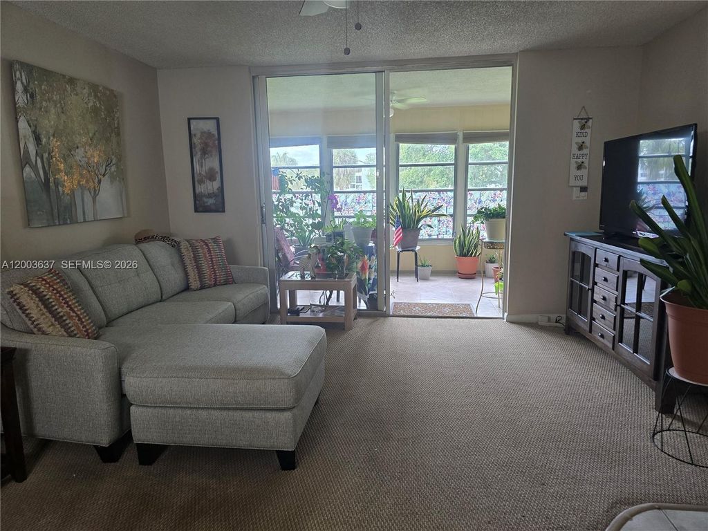 Photo of 7664 NW 18th St #204, Margate, FL 33063 (MLS # A12003637)