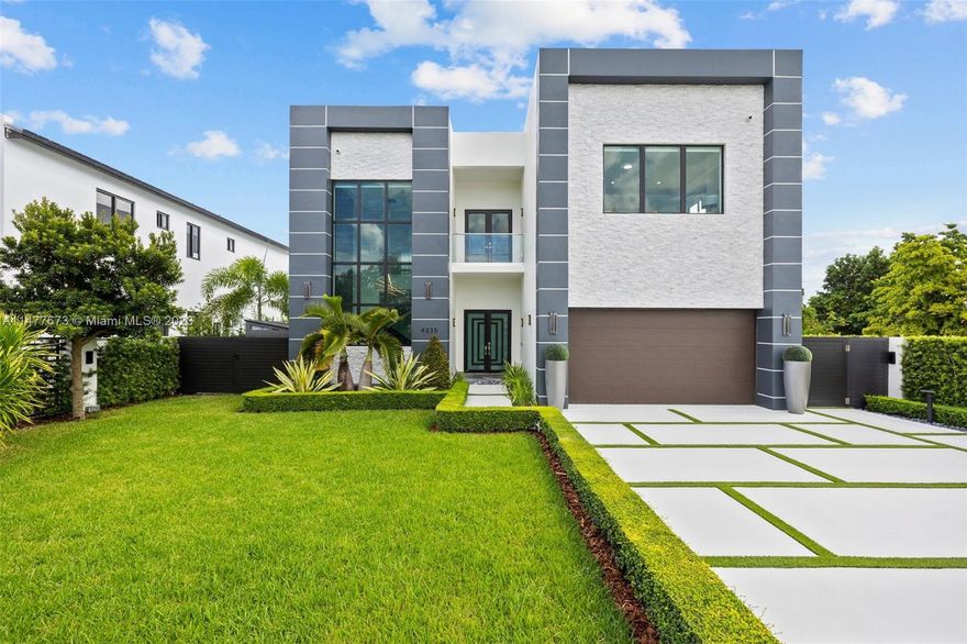 Welcome to this stunning 4 bedrooms, 5 bathrooms home with an open concept design that creates an inviting atmosphere.  The kitchen features a breakfast bar that seamlessly connects to the living area, making the ideal space for entertaining guests. The outdoor backyard is a perfect oasis for outdoor living, with a large salty pool with a heated spa for your convenience and a complete outdoor kitchen perfect for hosting. Concrete fence and aluminum gated around the property for privacy. This home is truly a gem, providing a perfect balance of comfort, luxury and convenience.