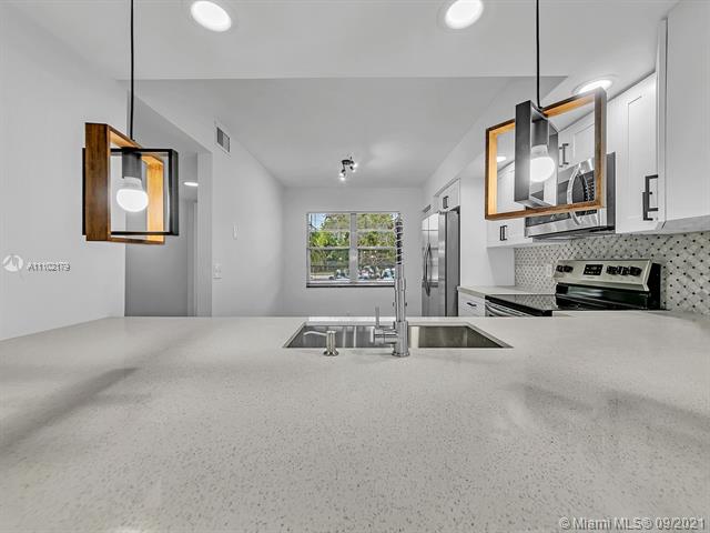 BEST VIEW in Century Village! This gorgeous bright, modern and completely remodel condo would welcome you upon entering the front door into a beautiful open concept. This Jasmine model offers a relaxing welcoming entrance from the complete open kitchen into the living/dining room and even a gorgeous view of the golf course. Kitchen has been tastefully upgraded with the soft closing white cabinets, white quartz, gray modern hexagonal backsplash and stain-steel appliances, laminate waterproof flooring, smooth walls and ceiling finishes and very modern bathrooms. Be part of the Best 55+ community of the area offering resort-style amenities with numerous options to stay socially and physically active. come and enjoy endless and resort amenities!