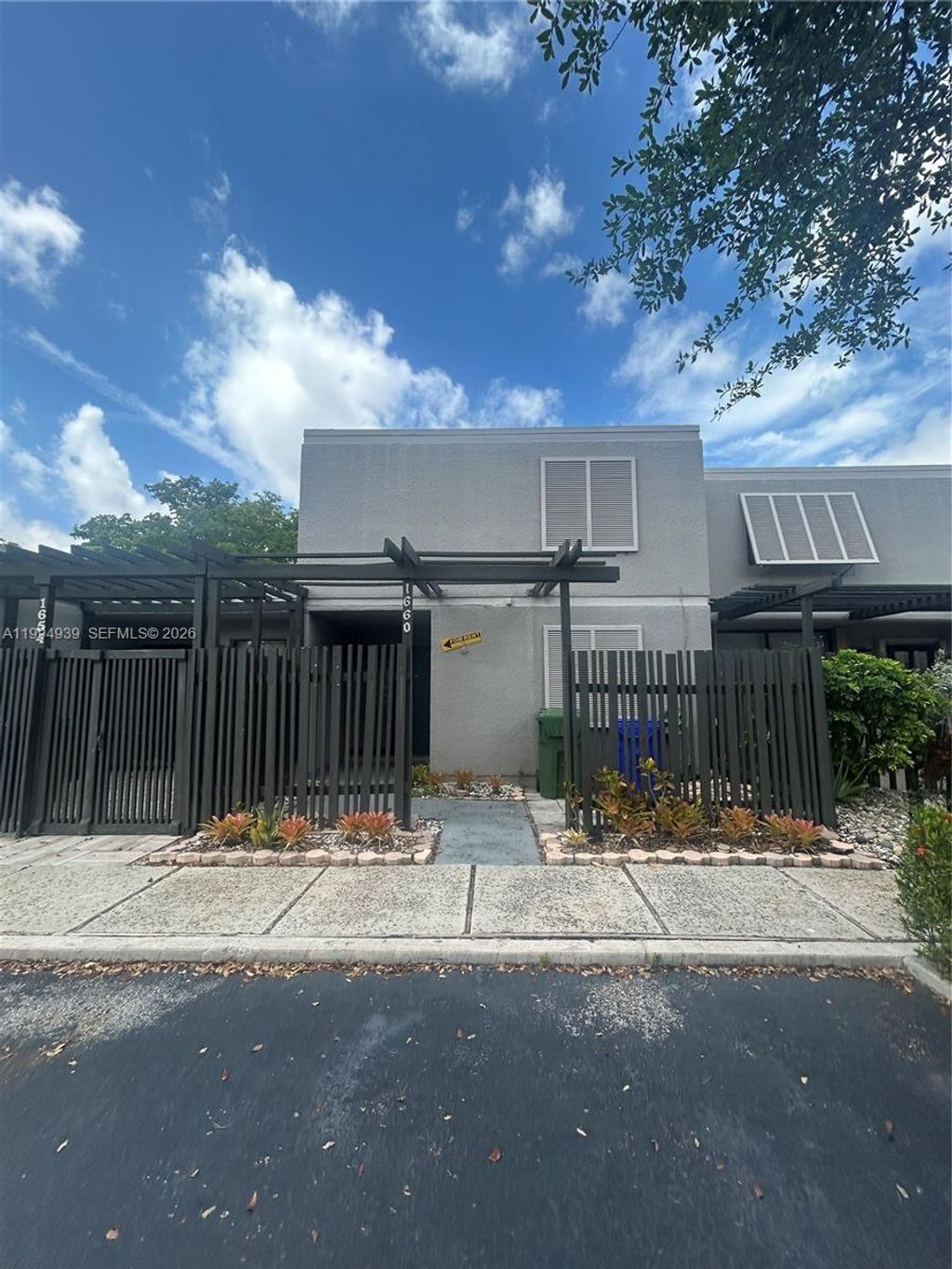 Photo of 1660 NW 113th Way, Pembroke Pines, FL 33026 (MLS # A11994939)