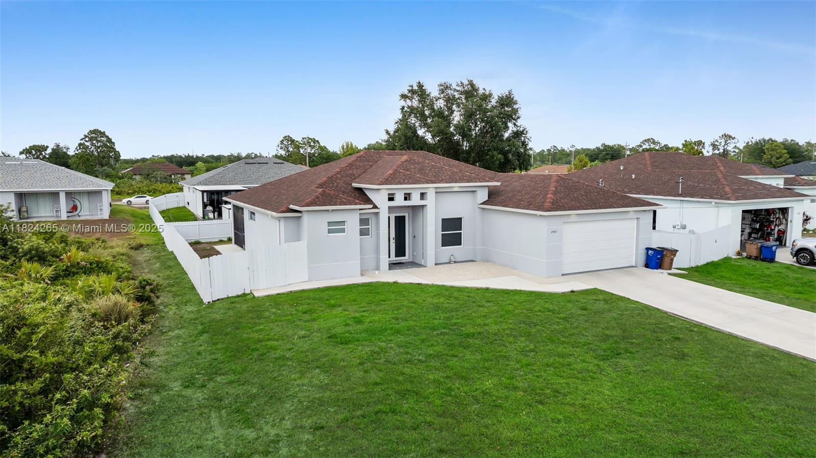 its a must see! This beautiful property has 3 bedrooms + den and 2 bathrooms with almost 1900 sf under air on a .25 acre fenced lot. Tile throughout the entire home with impact windows and doors. Spacious Master Bedroom with tub and shower. The kitchen comes with plenty of cabinetry and with a waterfall quartz style island with matching quartz backsplash. The backyard has a screened lanai ideal for relaxing or family time. The only thing missing other then a pool , its you.