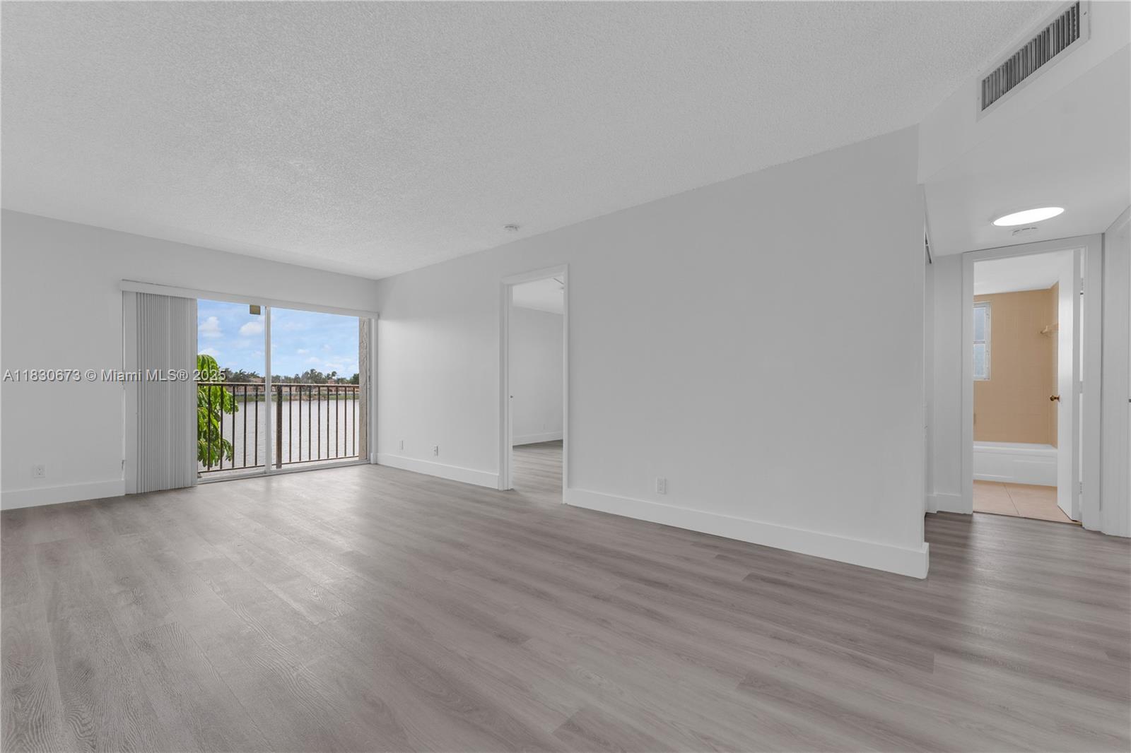 Beautiful corner unit with amazing waterfront view! Located on the second floor, enjoy lake view from main bedroom and living room. This updated unit contains in-unit washer/dryer. Gated community with 24/7 security, community pool, plenty of guest parking, and low HOA fees. Enjoy the amenities plus nearby parks and walking paths. Ideal for homeowners or investors—high rental demand. Seller is motivated and ready for quick closing. Great location near shopping, dining, and major highways. A Must See!