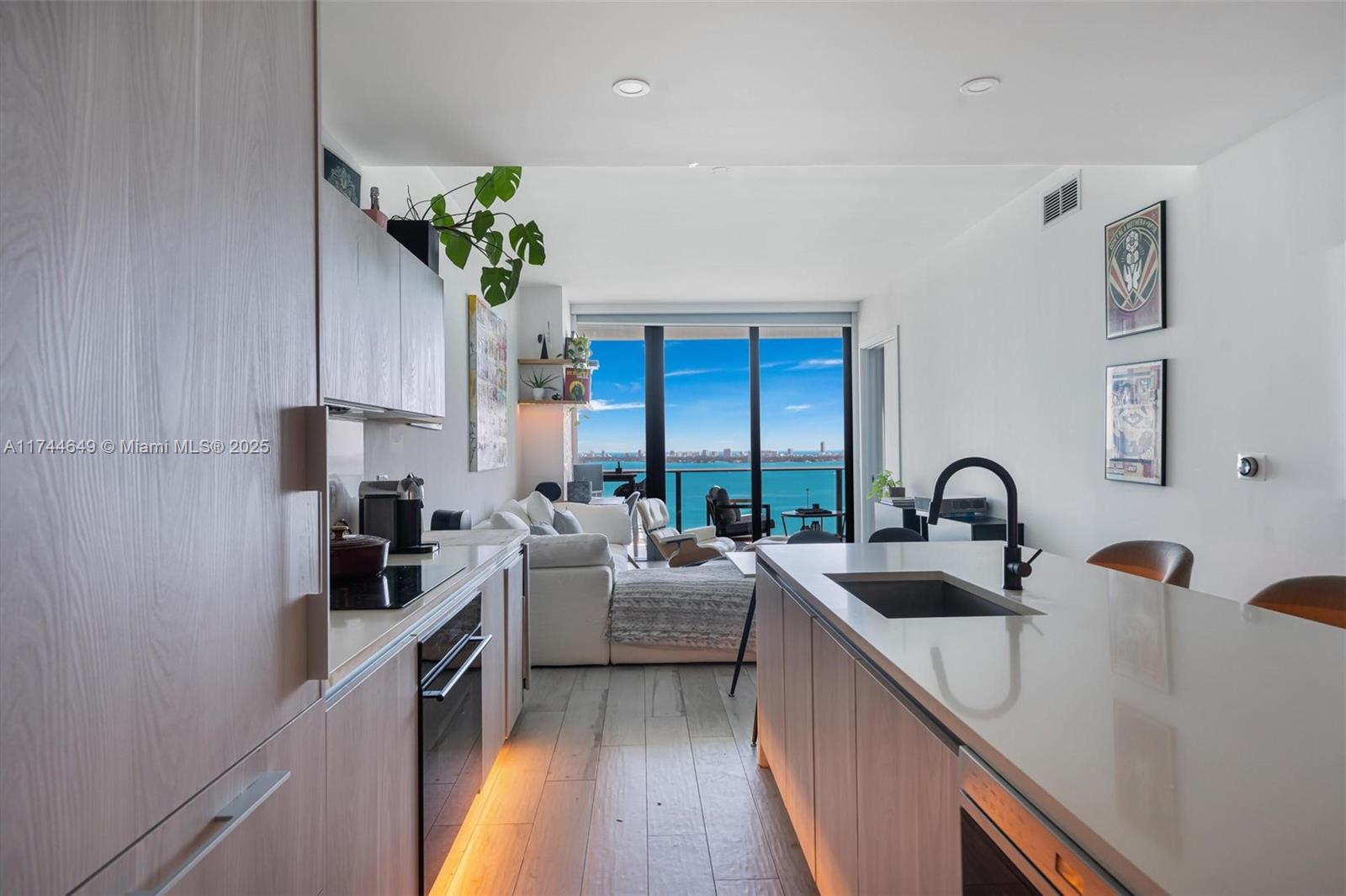 Elegantly designed and Perched on the 23rd floor of Gran Paraiso, this oversized 1 bed/2bath residence offers breathtaking views of the bay, ocean with 8-foot-deep terrace and private entry elevator. Every detail has been meticulously curated, from custom designer wallpaper and a beautifully crafted entrance inspired by iconic luxury hotels to bespoke cabinetry and shelving with LED lighting, waterfall countertop. Thoughtful upgrades include a wine cellar, custom faucets, electric blinds, and extra storage. Fully integrated smart home with Phillips Hue lighting, Sonos sound system and Nest Thermostat, Set within Gran Paraiso’s world-class amenities, including a gym, spa, bowling & tennis courts. Bonus: Ultimate convenience : LOBBY LEVEL parking spot. OFFERED FURNISHED or NON FURNISHED