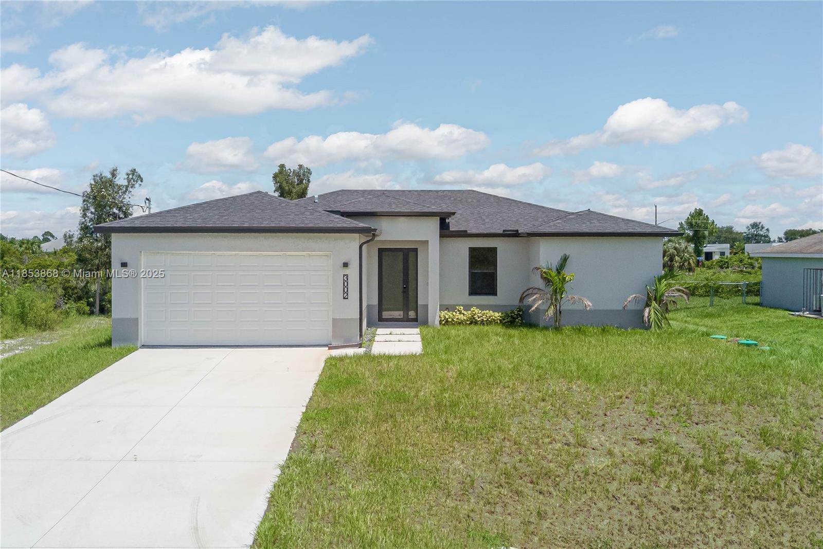Builder is giving $10,000 towards buyer's closing costs! NEW CONSTRUCTION home in Lehigh Acres! This spacious 3-bedroom house, plus a Den, has an open layout that’s perfect for everyday living. The kitchen features great appliances, quartz countertops, and plenty of cabinet space. You’ll love the impact doors and windows, a covered garage, and a patio with room for a pool. Located near the main arteries, it offers easy access to everything you need. The master suite is a relaxing getaway with its own bathroom and a big closet, while the other bedrooms are comfortable and share a nicely designed bath. Don’t miss your chance to make this great home yours!