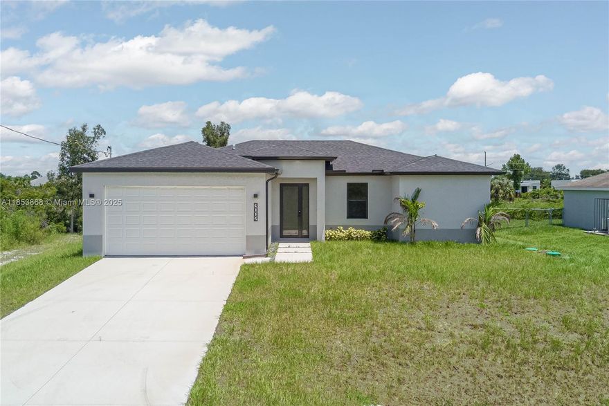 NEW CONSTRUCTION home in Lehigh Acres! This spacious 3-bedroom house, plus a Den, has an open layout that’s perfect for everyday living. The kitchen features great appliances, quartz countertops, and plenty of cabinet space. You’ll love the impact doors and windows, a covered garage, and a patio with room for a pool. Located near the main arteries, it offers easy access to everything you need. The master suite is a relaxing getaway with its own bathroom and a big closet, while the other bedrooms are comfortable and share a nicely designed bath. Don’t miss your chance to make this great home yours!