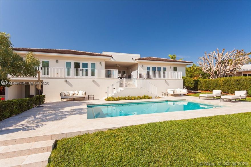 Completely reimagined waterfront oasis delivering the quintessential South Florida lifestyle, with direct ocean access and no fixed bridges. This exceptional residence showcases a designer entertainer’s kitchen outfitted with top-of-the-line appliances, seamlessly flowing into a bright, open-concept layout curated for both elevated living and effortless hosting. Expansive living spaces open gracefully to a covered waterfront terrace, creating the perfect indoor-outdoor experience. The primary suite is a private retreat, featuring two oversized closets and its own terrace overlooking tranquil water views. Additional living spaces include a versatile den, spacious family room, and well-appointed guest quarters on the main level—ideal for both comfort and privacy. A generous two-car garage and ample storage complete the home’s functional appeal. Perfectly positioned just minutes from Downtown Miami and the beaches, this residence also benefits from Coral Gables’ renowned selection of top-tier public and private schools. A Beautiful Miami Home. Make it Rein!