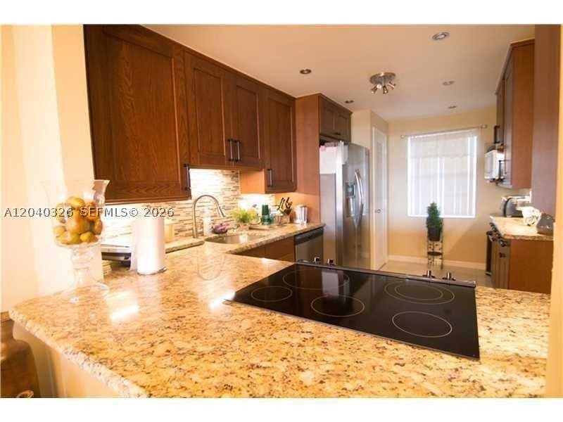 Photo of 4030 W Palm Aire Dr #505, Pompano Beach, FL 33069 (MLS # A12040326)