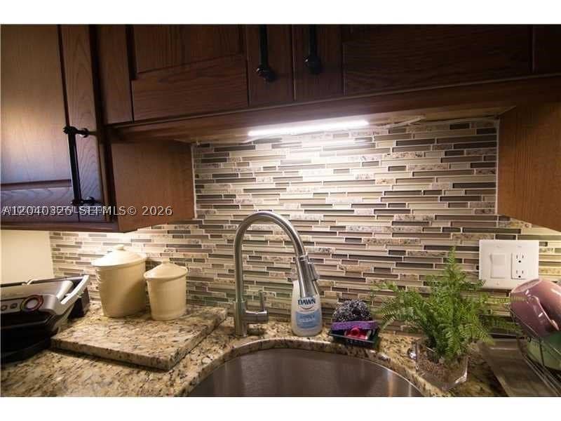 Photo of 4030 W Palm Aire Dr #505, Pompano Beach, FL 33069 (MLS # A12040326)