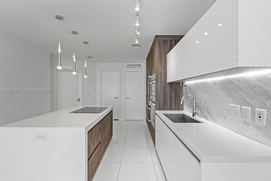 Live above it all at Paramount Miami Worldcenter. This oversized 1 bed + fully converted den lives like a true 2 bedroom, with the den featuring its own bathroom and in unit laundry, ideal for guests, a home office, or flexible living. Total interior size over 1,000 sqft with a smart, open layout and floor to ceiling glass that brings in natural light and city energy. In the heart of Miami Worldcenter, steps from Brightline, parks, dining, entertainment, and minutes to Brickell, Wynwood, and Miami Beach. A rare opportunity to secure a flexible floor plan in a full service luxury building at a compelling value. Easy to show.