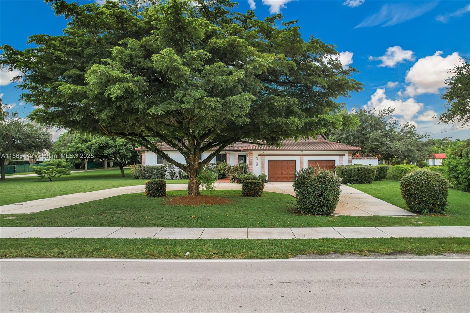 Welcome to the most prestigious neighborhood in Miami known as North Pinecrest. Surrounded by multimillion dollar homes, this Ranch Style property sits on an Acre Lot of luscious greenery and trees all around. The home itself features 3 VERY Spacious Bedrooms, 2.5 Bathrooms and a 2-Car Garage. Art deco-styled terrazzo flooring throughout the entire house, along with Impact Windows with blinds and Upgraded Kitchen Appliances. Built in Closets for all the Bedrooms and beautiful outdoor patio area. Blocks aways from the highest ranked rated schools, Dadeland Mall with tons of options for dining/shopping and the South Miami neighborhood, this home is conveniently located in the center of it all!
