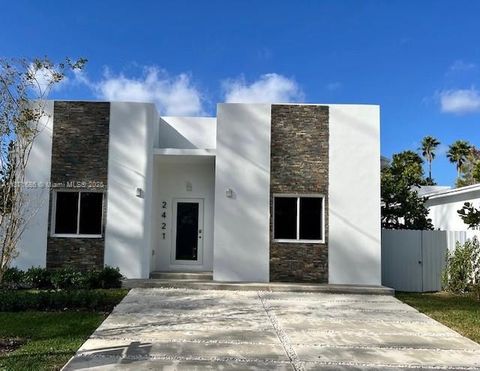 Photo of 2421 NW 23rd Ln, Fort Lauderdale, FL 33311 (MLS # A11871686)