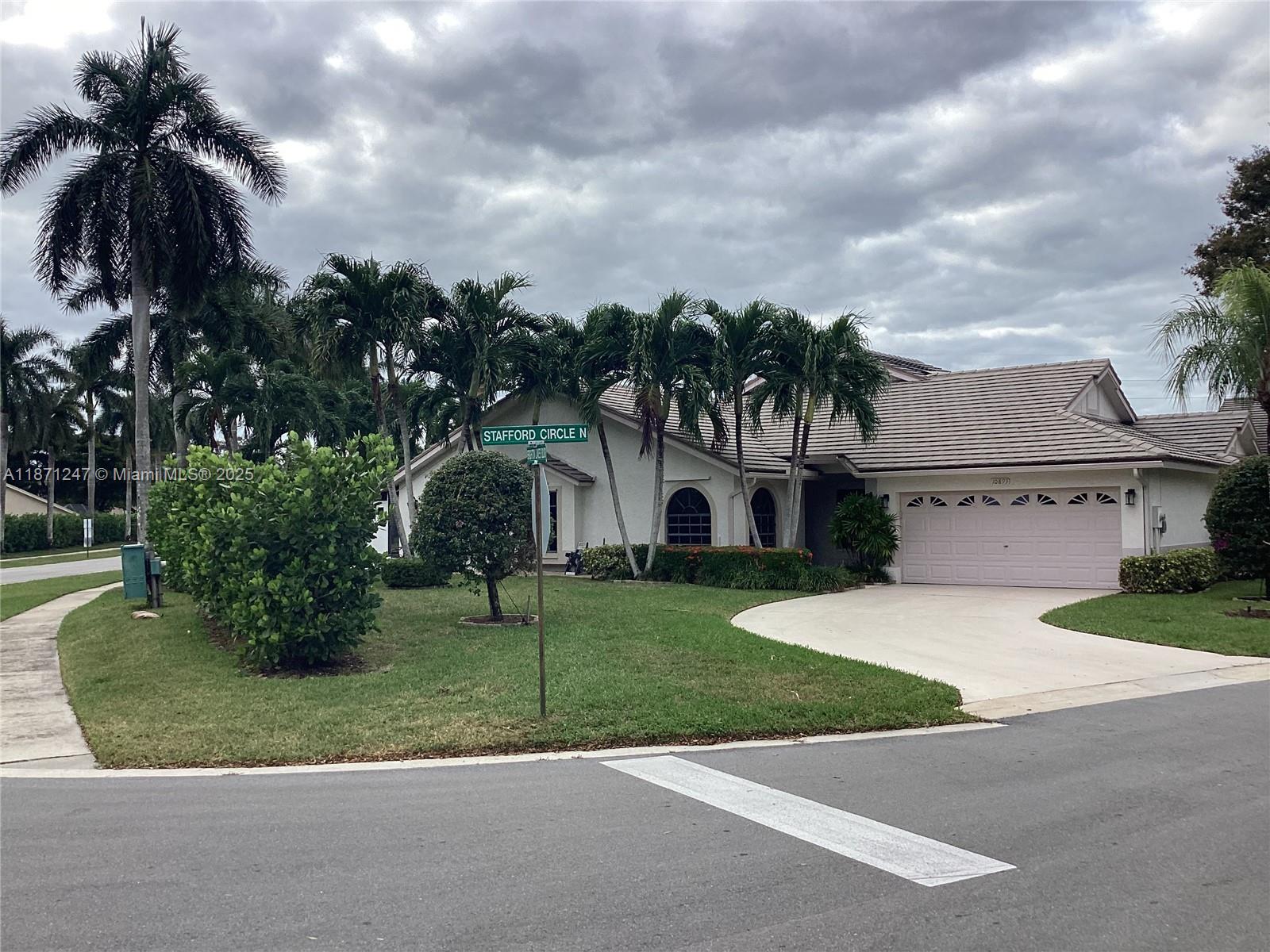 BEAUTIFUL ONE STORY CORNER VILLA WITH 2 CAR GARAGE. OPEN LIVING ROOM/DINING ROOM WITH VAULTED CEILINGS. CERAMIC FLOORS THROUGHOUT. SPACIOUS GLASS ENCLOSED FLORIDA ROOM OVERLOOKING PEACEFUL GARDEN WITH IT'S OWN NEW A/C AND NEW TILED FLOOR. NEWER 2.5 TONS A/C. NEW LANDSCAPING AND SPRINKLER SYSTEM AS WELL AS PAVERS ALONGSIDE THE VILLA. NEW PLUMBING ACCORDING TO CODE. NEWER APPLIANCES. FULL SIZE WASHER/DRYER. FIBER OPTIC INTERNET AND CABLE INCLUDED IN LOW HOA FEE. DESIRABLE COMMUNITY WITH HEATED POOL, TENNIS, CLUBHOUSE AND FITNESS CENTER. HOUSING FOR OLDER PERSONS 55+. CLOSE TO SHOPPING, RESTAURANTS.