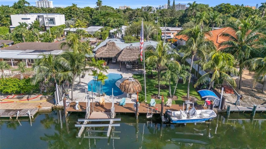 Waterfront Paradise in Keystone Point Experience true Florida living in this rare waterfront gem featuring 75 feet on the water and effortless indoor-outdoor elegance. Enjoy a custom beach-entry pool, waterfall jacuzzi, and two tiki huts with a full outdoor BBQ kitchen, perfect for entertaining. Inside, a chef’s kitchen with Wolf gas cooktop, Sub-Zero refrigerator, and the spa-inspired primary suite with walk-in closet create the ultimate retreat.
Boaters will love the 13-ft bridge clearance, 24,000-lb boat lift, and gas pool heater, ideal for year-round enjoyment. Keystone Point, North Miami, where luxury meets coastal lifestyle.