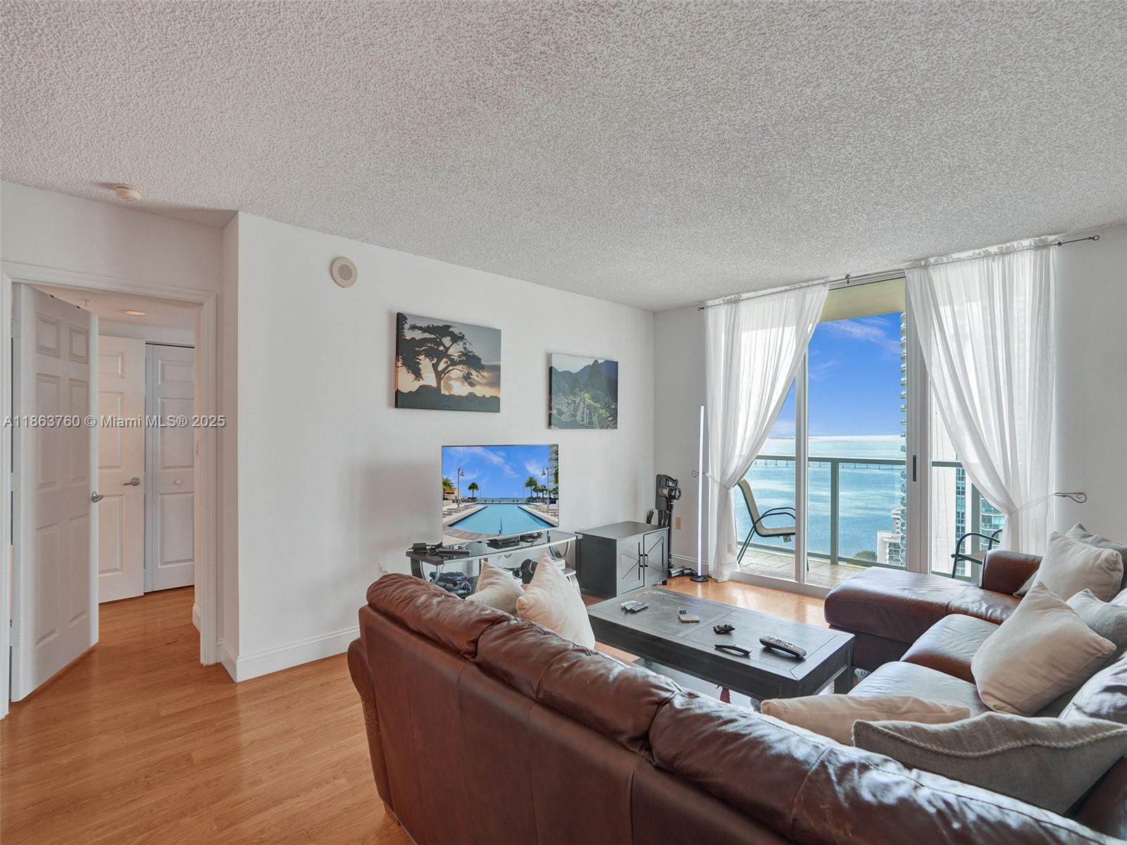 This GORGEOUS 2 bdrm 2 bath split bedroom plan features an open kitchen with beautiful white cabinetry, white quartz countertops and Whirlpool stainless steel appliances. It has BEAUTIFUL bay and city views! The kitchen and both bathrooms were beautifully remodeled in 2024. The main living area and both bedrooms have laminate wood flooring and both bathrooms have light gray tile. Master bedroom has 2 closets and both bedrooms have blackout shades. There is a full size washer/dryer in the unit. The Mark has spectacular amenities which include a bay front pool, hot tub, BBQ area, tennis courts, convenience store and state of the art fitness center. Crazy About You restaurant is on the 1st floor. Water, basic cable & internet & 1 parking space are included.