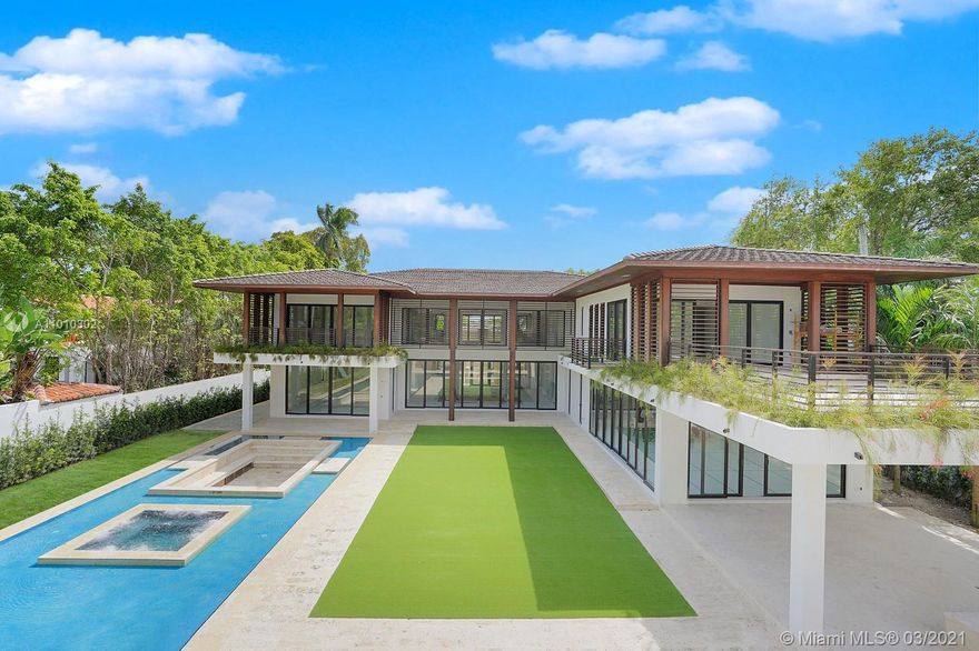 This tropical modern masterpiece was designed by the distinguished architect, Cesar Molina. Boasting 8 bedrooms and 10 bathrooms plus a family room with a fireplace wall allow for plenty of entertaining opportunities. Some of the home's most notable features are a movie theater, library, bar, and expansive garage area designed to fit up to 8 cars.

Open your floor-to-ceiling sliding glass doors and step outside to your salt-water pool, jacuzzi, fire pit, and vast yard before heading up to the guest house which includes a sauna and steam room. 

Close to some of the best schools in Miami and located just 5 minutes from luxury shops and dining in Coconut Grove, this home is set to be completed by May 2021.