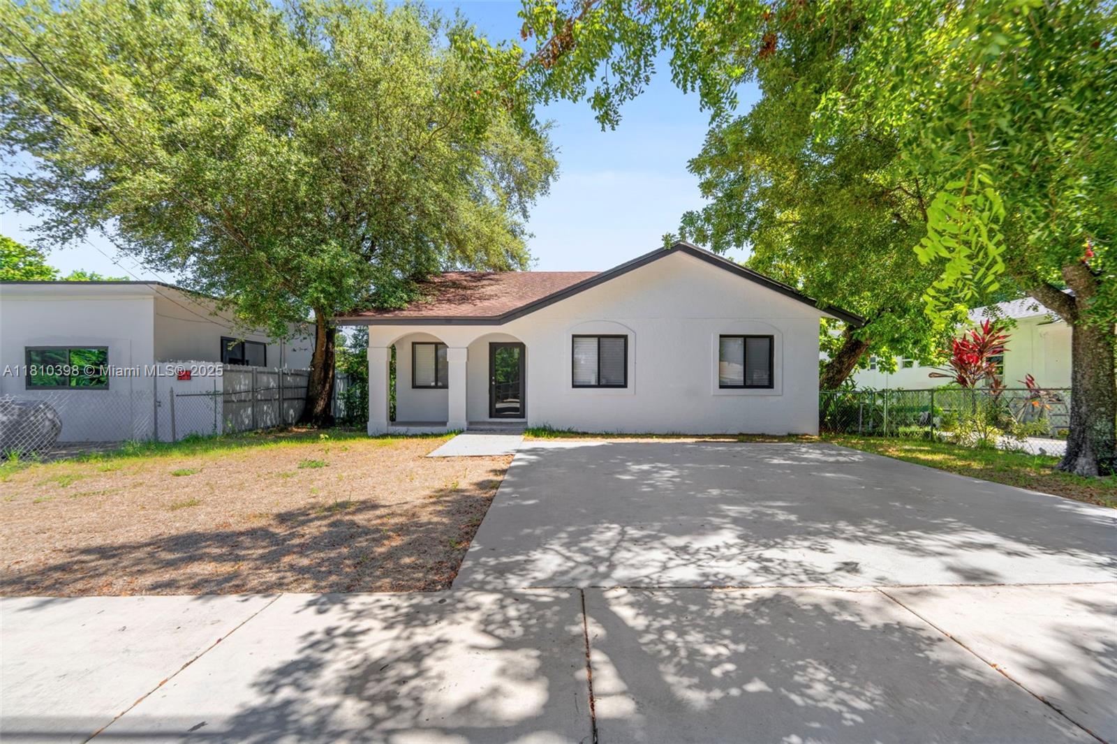 Step into this fully updated residence featuring a modern open-concept layout, sleek tile flooring throughout, and a brand-new kitchen with quartz countertops and stainless steel appliances. Both bathrooms have been tastefully renovated with contemporary finishes. Enjoy peace of mind with updated electrical, plumbing, Brand new impact windows, and a newer roof. Spacious backyard with room for entertaining or future expansion. Conveniently located near major highways, schools, shopping, and just minutes from Wynwood, Downtown, and Miami International Airport. Move-in ready and perfect for homeowners or investors alike!