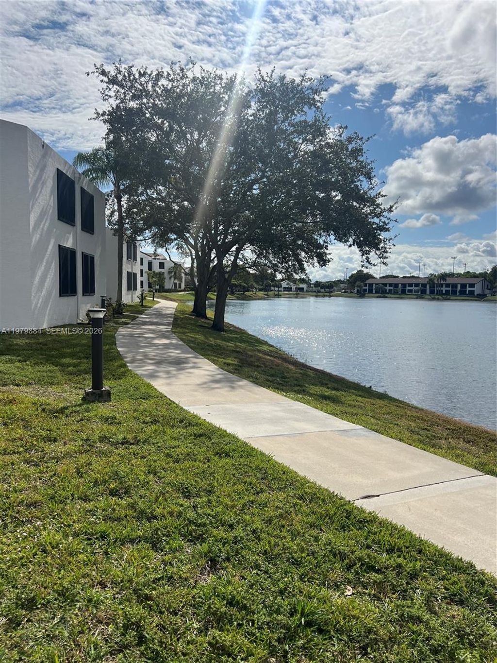 Photo of 215 Lake Pointe Dr #211, Oakland Park, FL 33309 (MLS # A11979884)