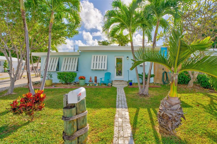 Your Private Slice of Key Largo Paradise Awaits! Escape to a quiet coastal retreat designed for relaxation and adventure. This beautifully updated concrete 1-bedroom, 1-bath home is situated on a corner lot in the heart of Key Largo is just steps from the water and beckons you to embrace the island lifestyle. This is like living on the water without paying the premium price. 2 kayaks and bicycles are included. Boating enthusiasts will love the easy access to the ocean via Adams Cut or Tavernier Creek. Evenings are for unwinding in the outdoor hot tub or hosting memorable gatherings on the paved patio under garden lighting, surrounded by lush tropical landscaping. Owner has taken care of the big-ticket items, including a new roof, new A/C split systems, fresh paint inside and out and impact windows/doors, making this charming gem completely move-in ready. There is room for a couple of cars and a 24' boat on trailer on the property. The community clubhouse and swimming beach offer even more opportunities for sun-soaked fun. The location is unbeatable—just minutes from Key Largo's dining, shopping, and outdoor attractions, with an easy commute to Miami. Whether you are seeking a refined vacation retreat or a full-time island residence, this home delivers a perfect balance of tropical comfort and coastal style. This is an amazing opportunity to embrace the best of the Florida Keys: boating, snorkeling, world-class fishing, scuba diving, or simply soaking up the sun.