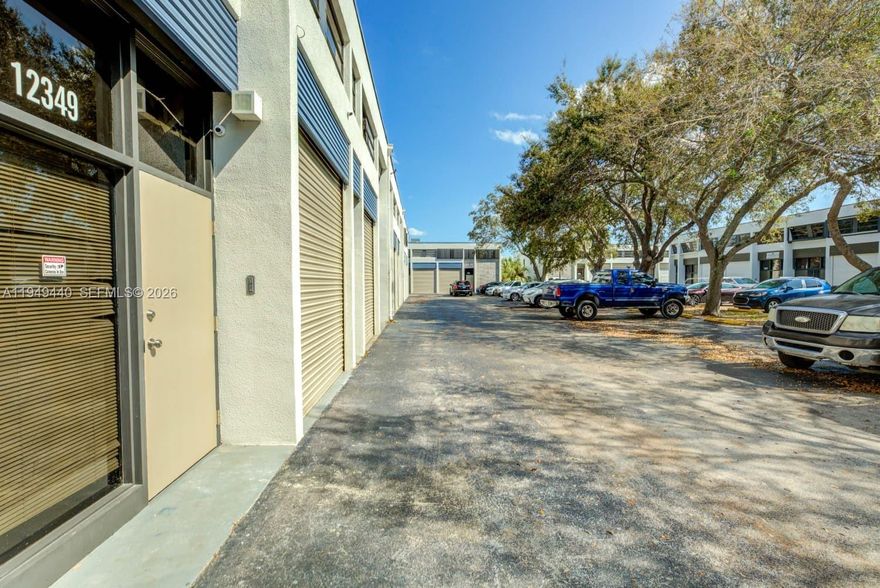 Gorgeous remodeled commercial two-story warehouse and offices, with separate entrances for the first floor and the second floor, large ground level bay door, four private offices upstairs, open warehouse area downstairs, two bathrooms (one upstairs and one downstairs), two assigned parking spaces, guest parking spaces and handicap parking spaces.  Additional on-street parking available.  Low maintenance fees at $300 per month.  Separate entrances for possible additional rental income.  Association is in excellent financial position, just passed the 40-year recertification.