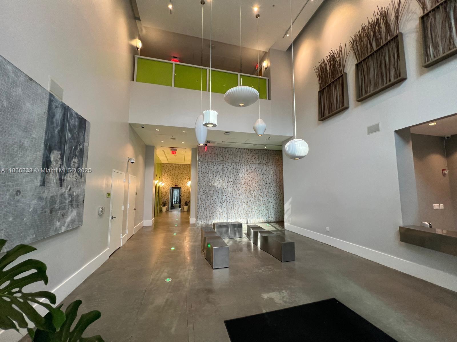 Modern loft in Loft II Downtown with 10-ft ceilings, polished concrete floors, and floor-to-ceiling impact windows. Features Italian-style kitchen with granite countertops and stainless steel appliances, in-unit washer/dryer. Enjoy rooftop pool and fitness center with panoramic views, ground-level lap pool, hot tub, sauna, clubroom, 24/7 concierge and secured garage. Direct MetroMover access in building. Walk to Bayside, Bayfront Park, Kaseya Center, shops, and dining